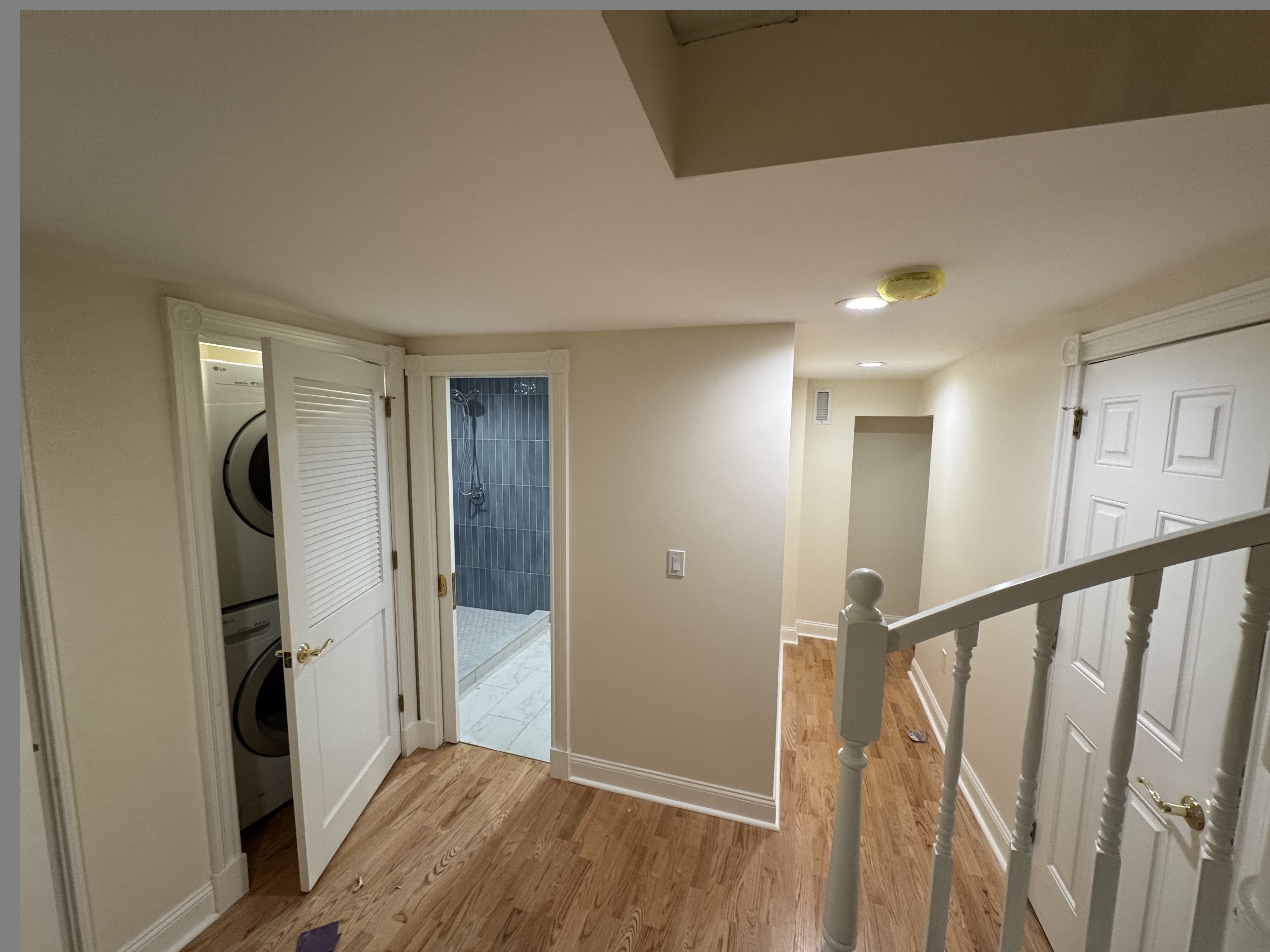 Hallway and stairway in clean, bright whites