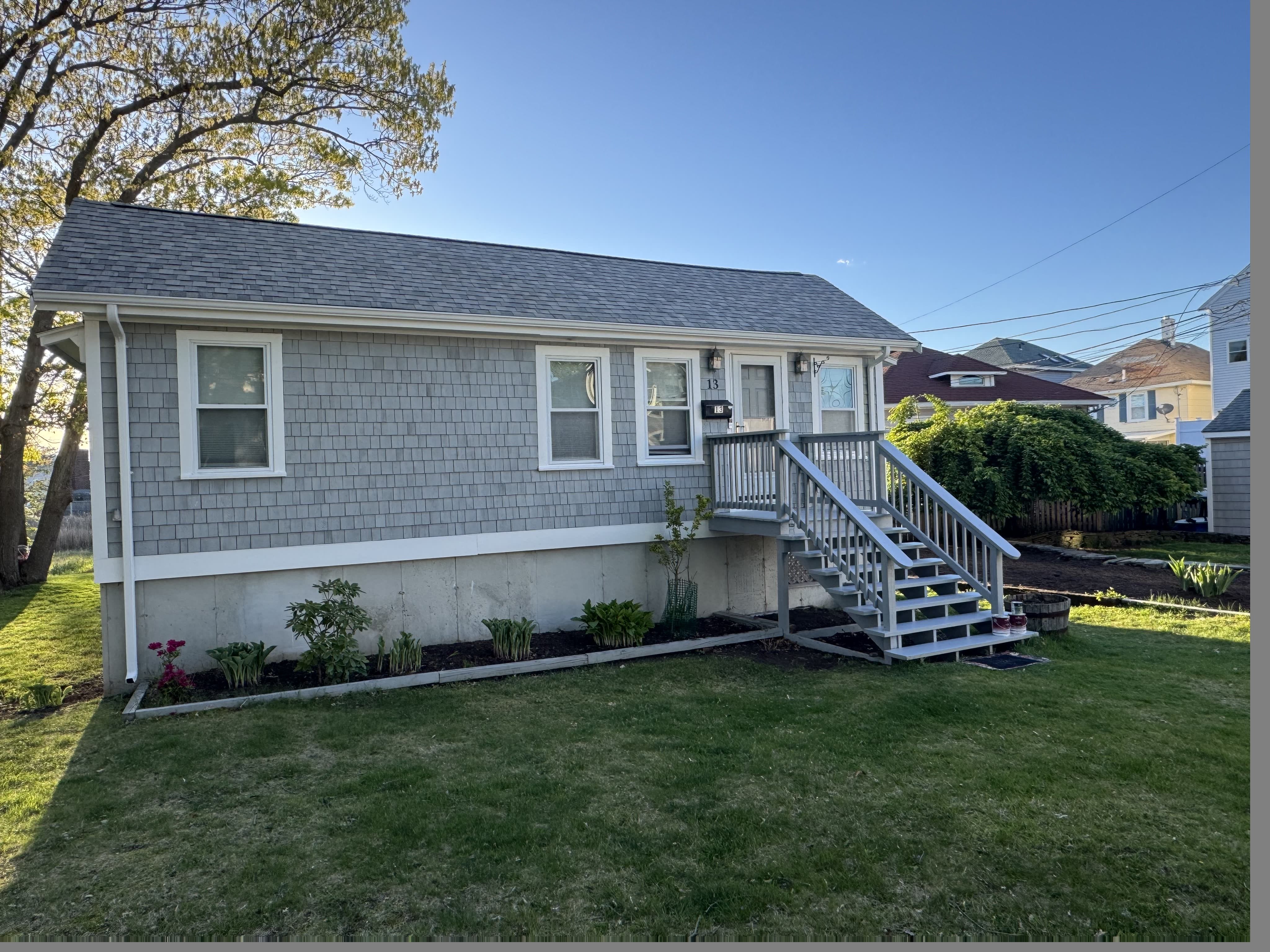 Exterior repaint — gray shakes with crisp white trim
